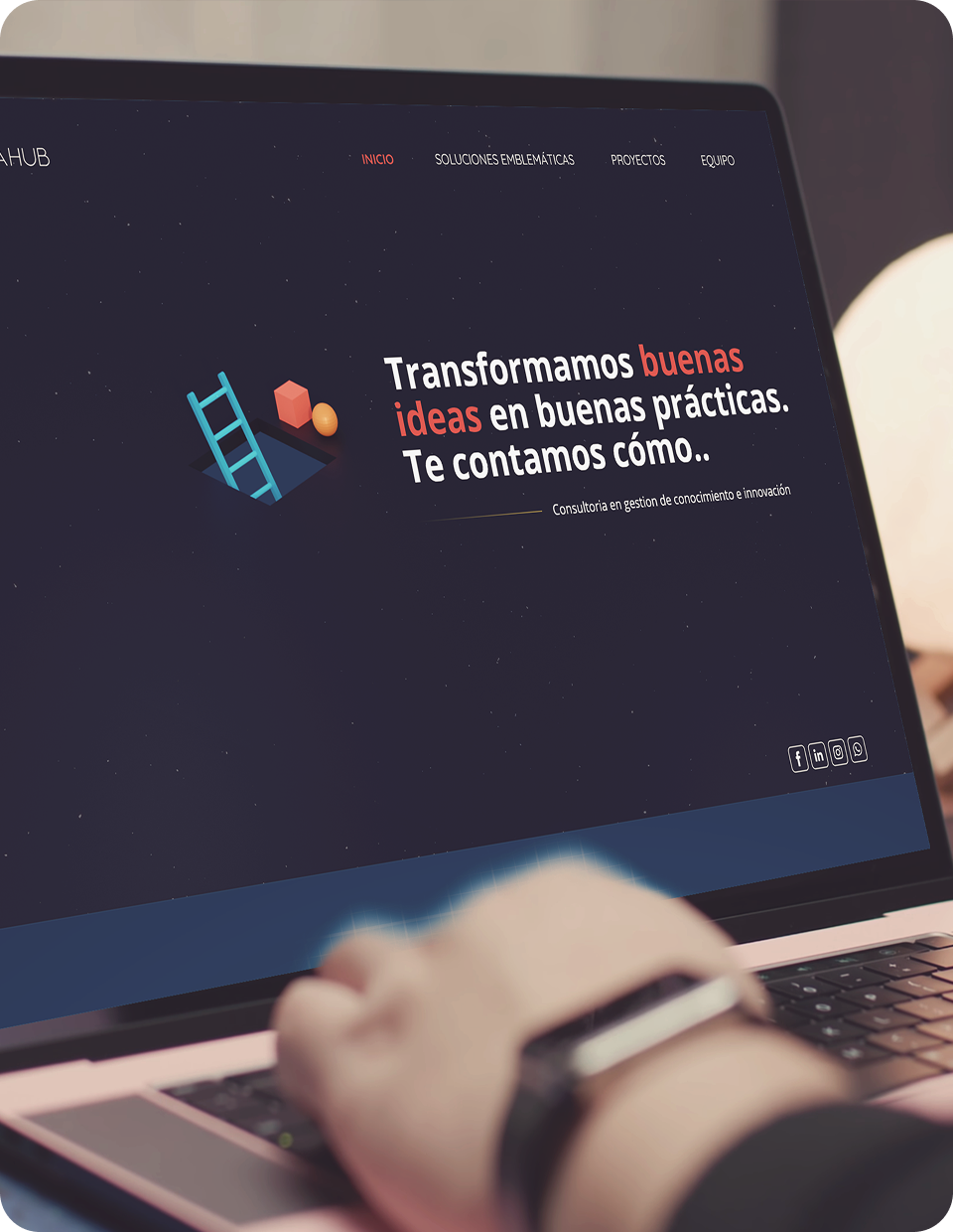 Laptop showing Innovahub Colombia website layout